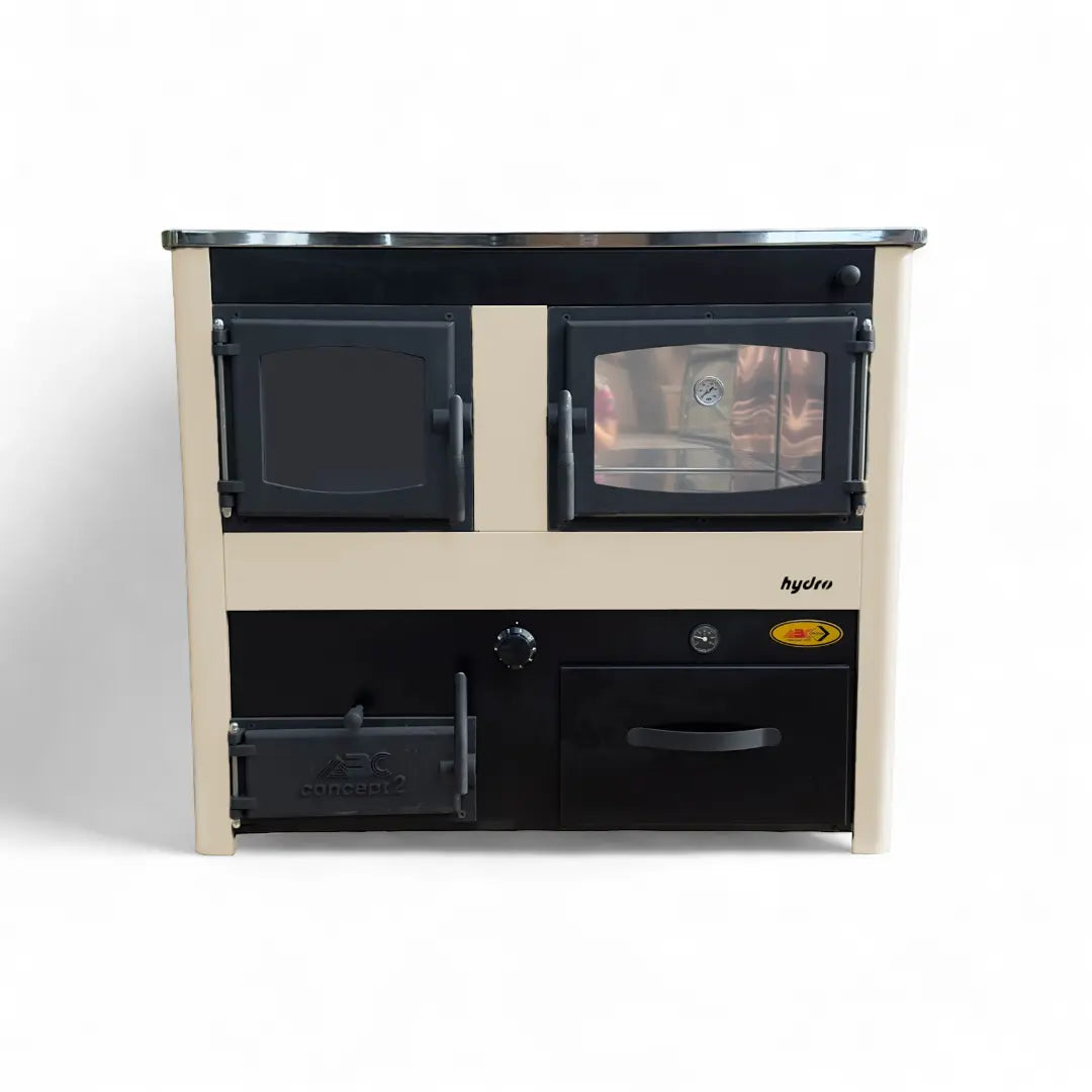 A compact dual-burn wood stove with a cream-colored frame and black doors, featuring two burners, a lower storage drawer, and a metal top surface, photographed against a plain white background.