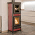 Wood-burning stove with red and black design in a modern kitchen setting