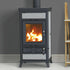 Wood burning stove with flames inside, placed against a gray wall.