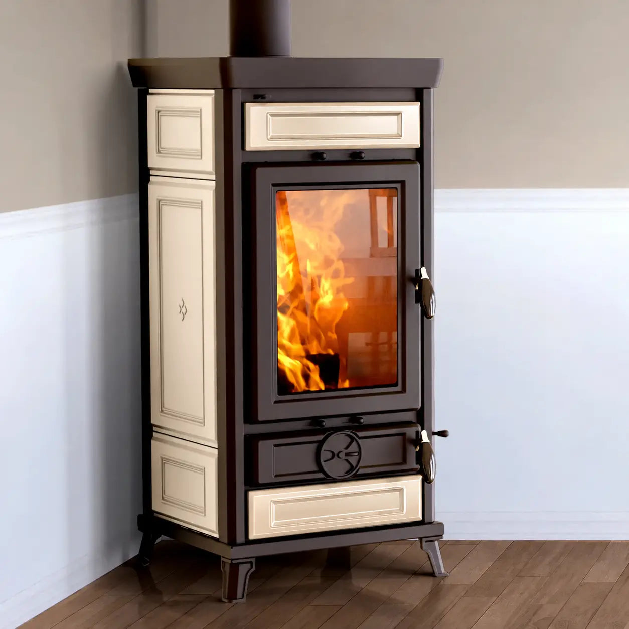 A freestanding wood-burning stove with a dark brown frame and cream-colored decorative panels, featuring a glass door showing a bright fire inside, set against a two-tone wall and wood floor.